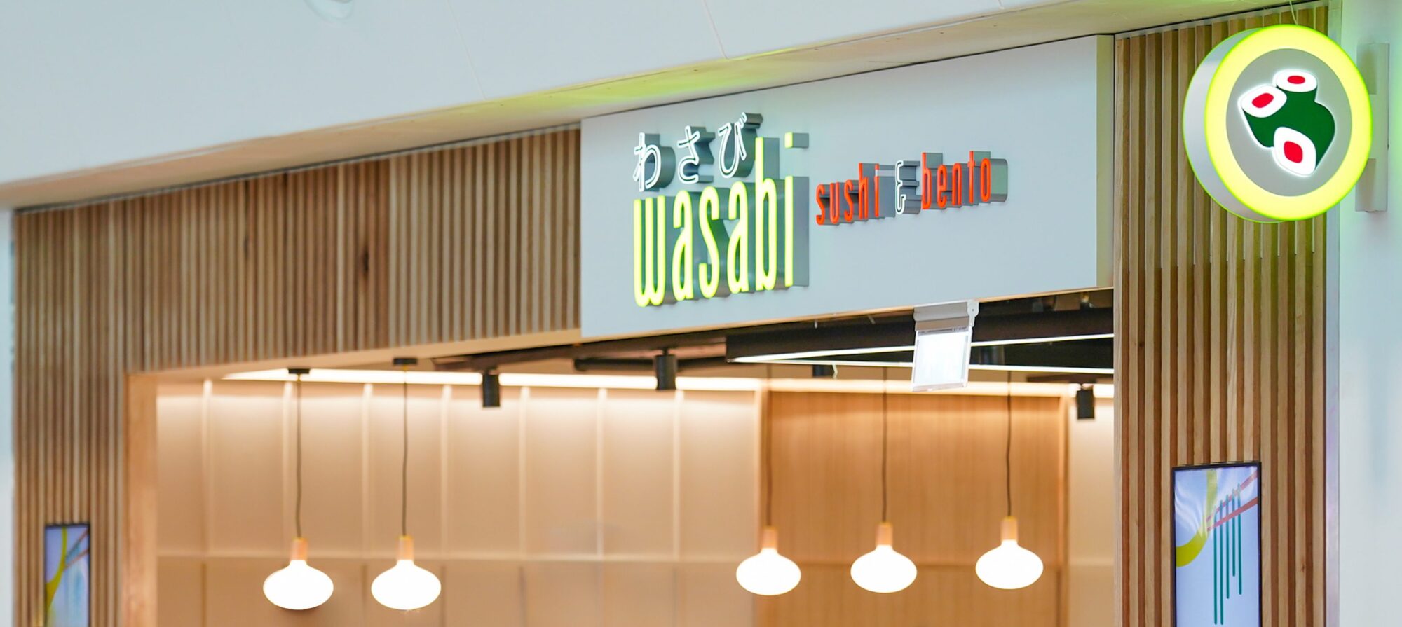 The image shows the storefront sign for a restaurant called 